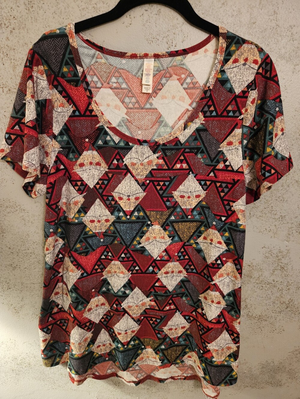 LuLaRoe Classic T Medium with geometric Christmas pattern with repeated Santa